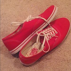Red low top vans.